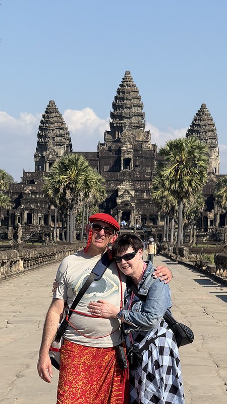 Susan and I standing on the causeway leading to Angkor Wat temple