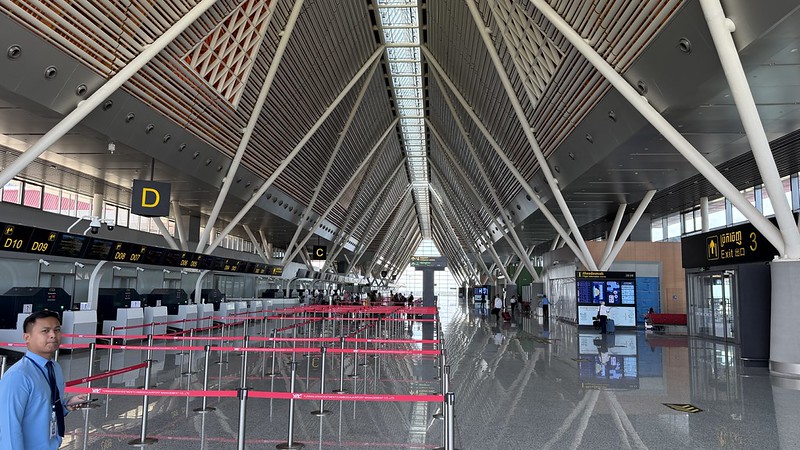 Siem Reap International airport passenger terminal it is a huge space with 30 check-in desks and about 20 people